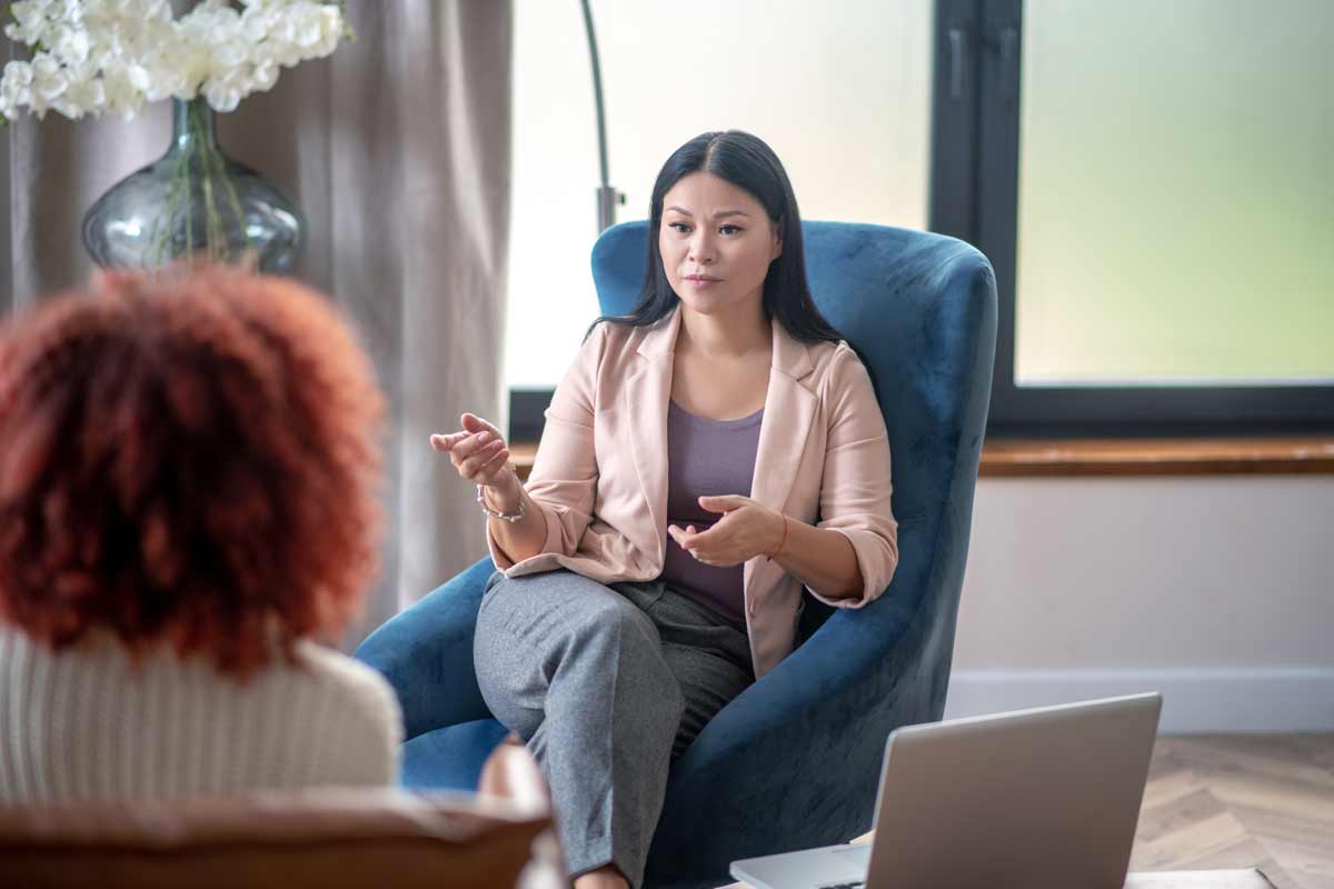 psychologist speaking with client